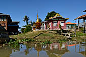 Inle Lake Myanmar. All the buildings are constructed on piles. Residents travel around by canoe, but there are also bamboo walkways and bridges over the canals, monasteries and stupas. 